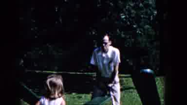 Hicksville New York (1955): Man Plays With Girl On Playground Amidst Nature In A