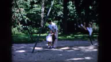 Hicksville New York (1955): Man Plays With Girl On Swing Toy In Nice Outdoor Area