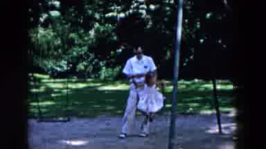 Hicksville New York (1955): Father Looking Down While Girl Child Is On Swing In