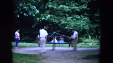 Hicksville New York (1955): Several Children Play On Ride At Playground As Mothers