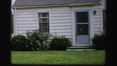 Albany New York (1955): A White House With Green Grass And Red Yellow Flowers On A