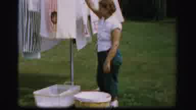 Albany New York (1955): Woman Standing By A Clothes-Line And Then Showing The