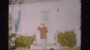 Albany New York (1955): Woman Standing Near The Front Door Of A House Putting The