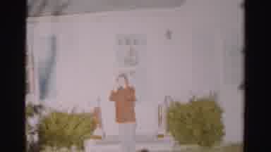 Albany New York (1955): Man In Orange Raincoat Going White House