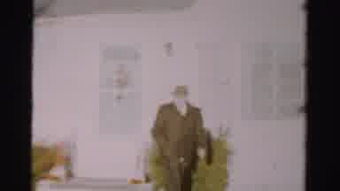 Albany New York (1955): Man In A Brown Leather Coat And A Fedora Walking Across A
