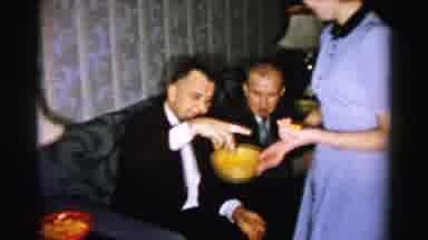 Albany New York (1955): Woman Wearing Blue Dress Holds Yellow Snack Bowl In Front