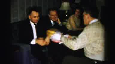 Albany New York (1955): Man Wearing White Gloves Offers Red And Yellow Snack Bowls