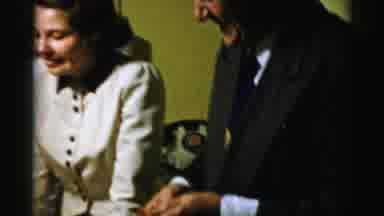 Albany New York (1955): Man Wildly Eating A Sandwich While Woman Watches And