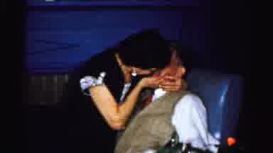 Albany New York (1955): Older Lady Kissing An Older Man Happily While Onlookers