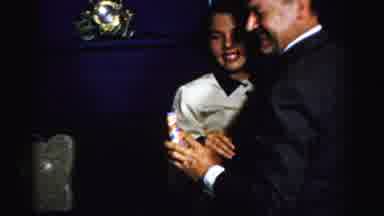 Albany New York (1955): Couple Dances While Man Wearing Blue Shirt Drinks From Red