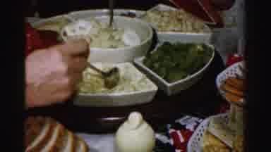 Albany New York (1955): Thanksgiving Day Family Serving Themselves On The Serve
