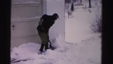 Albany New York (1955): Two Men Pierce The Ice Particles Around Her House With An
