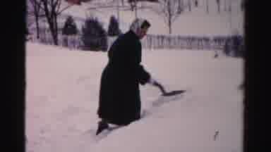 Albany New York (1955): Woman Wearing Long Coat Shoveling Several Inches Of Snow