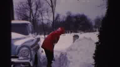 Albany New York (1955): Red Coat Clad Person Working Hard Shoveling Deep Snow