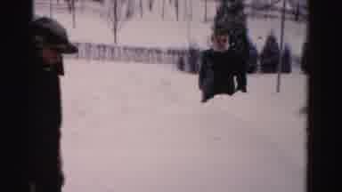 Albany New York (1955): Two Persons Are Clearing The Snow Particles In The Front