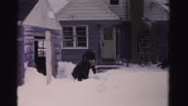 Albany New York (1955): Two Men Throw Ice Particles In Front Of The House