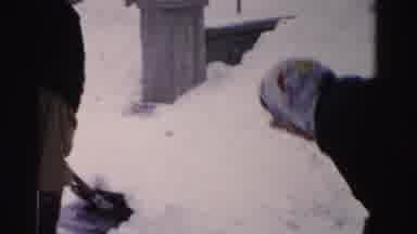Albany New York (1955): People Outside House Or Cabin Shovel Snow While One Person