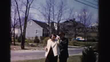 Albany New York (1955): Couple Plays With A Child Outside The House On A Nice