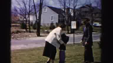 Albany New York (1955): There Is A Man Woman And Child Outside They Are In A Yard