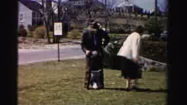 Albany New York (1955): A Man And Woman Are Playing With Their Child Outside