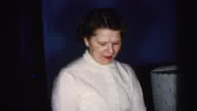 Albany New York (1955): Woman In A Green Dress Sitting Down While A Woman With A