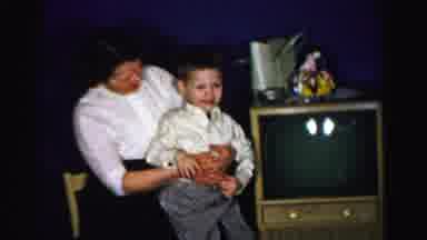 Albany New York (1955): Woman And Boy Wearing White Shirts Sit Next To Television