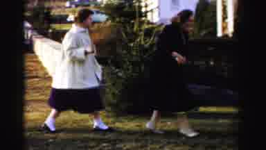 Albany New York (1955): Young Women Running Around In Front Of A Household Setting
