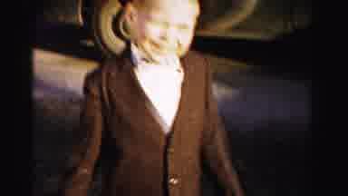 Albany New York (1955): A Little Boy Wearing Brown Suite Standing Outside And