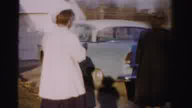 Albany New York (1955): Two Women Walk Up To A Blue Car And One Woman Puts Her