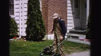 Albany New York (1955): Man Using A Gas Powered Lawn Mower By Manually Wrapping