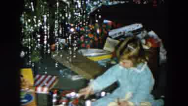 Hicksville New York (1956): Girl Wearing Blue Pajamas Plays With Silver Objects