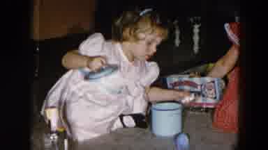 Hicksville New York (1956): Girl Wearing Pink Dress Puts Objects Into Light Blue