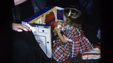 Hicksville New York (1956): Plaid Dressed Girl Is Excited To Open Up The Rest Of