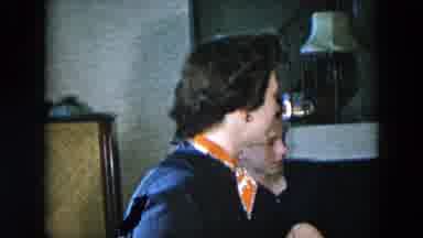 Hicksville New York (1956): A Women Speaking In A House While Not Looking In The