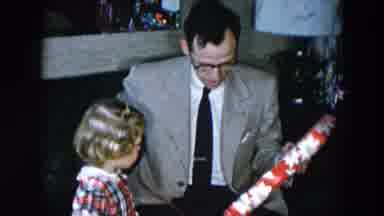 Hicksville New York (1956): Girl Watches Man Wearing Grey Jacket Open Christmas