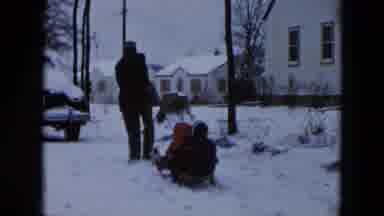 Hicksville New York (1956): Two People Playing In The Snow On A Cold Winter Day