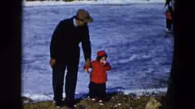 Hicksville New York (1956): Man Walking With Small Child In Red Coat Next To