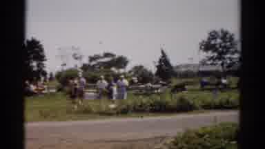 Catskill New York (1957): Group Of Old People Walking Together On A Grass Field As