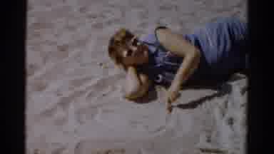 Catskill New York (1957): A Girl Playing In The Sand And A Family Sitting On The
