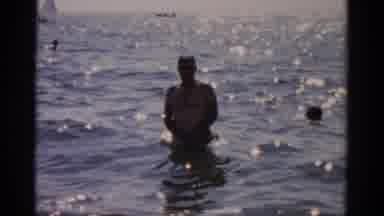 Catskill New York (1957): Man Jumps Around In The Ocean As Other Swim Around Him