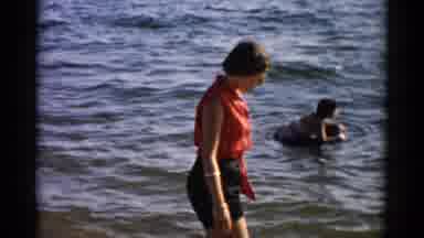 Catskill New York (1957): Woman Shuffles Her Feet In Water Cuts To A Woman Looking