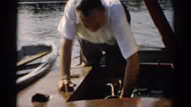 Catskill New York (1957): A Man Fixing Something On His Boat And A Bird Flying