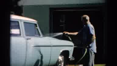 Catskill New York (1957): Man Washing Light Blue Car On A Bright Sunny Day