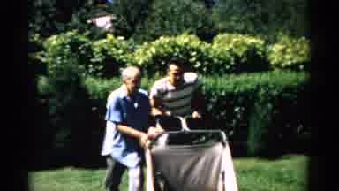 Catskill New York (1957): Men Push A Cart In A Yard Over The Grass An Empty
