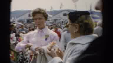 Catskill New York (1957): People Eating Food At A Carnival While Talking About The