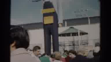 Catskill New York (1957): People Walking Past Large Sculpture Of Person Wearing