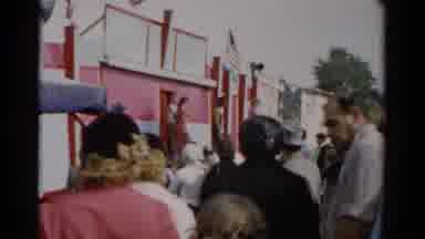 Catskill New York (1957): People Gathering In Front Of Red Building On A Clear Day