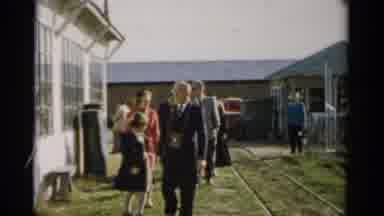 Catskill New York (1957): Man Walking Next To A Child On A Sunny Day With Adults