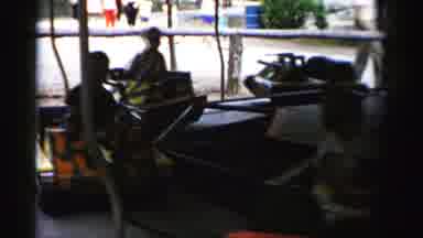 Catskill New York (1957): Children Riding In Metal Toy Tanks On A Merry-Go-Round