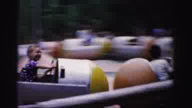 Catskill New York (1957): People Riding Red Yellow And Silver Capsule Cars On A